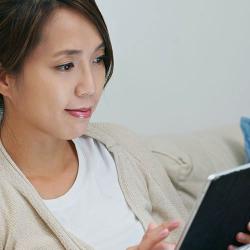 Woman reading on a digital device