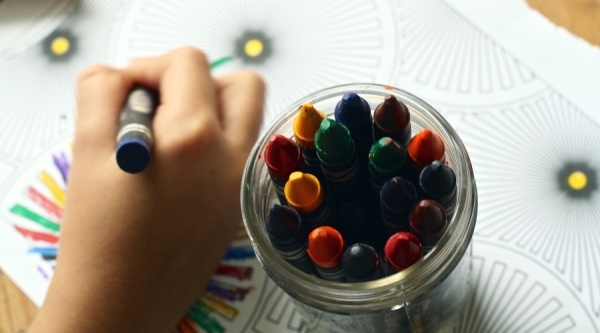 Person colouring with crayons