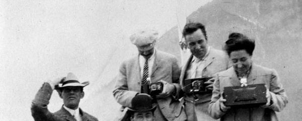 vintage photograph of a group of people holding cameras