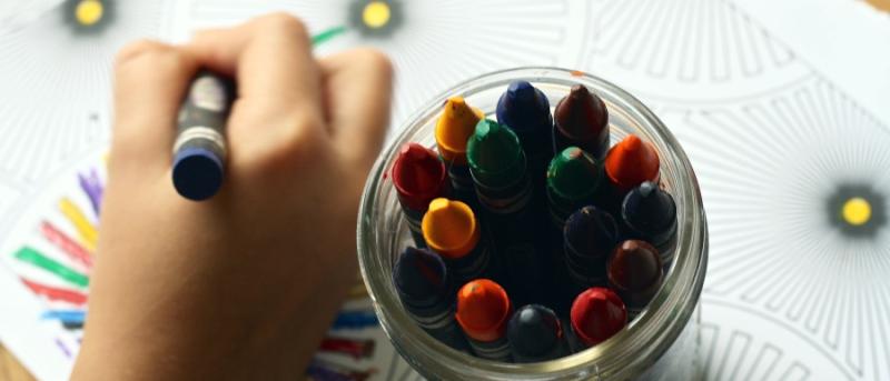 Person colouring with crayons